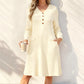 A Lovely V-Neck Ribbed Knit Dress with a Flattering A-Line Shape and Just the Right Touch of Elegance