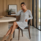 A Lovely V-Neck Ribbed Knit Dress with a Flattering A-Line Shape and Just the Right Touch of Elegance